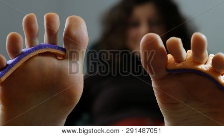 Womens Toes With Finger Separators Close-up In The Office Of The Beautician, Wiggles His Fingers, Pe
