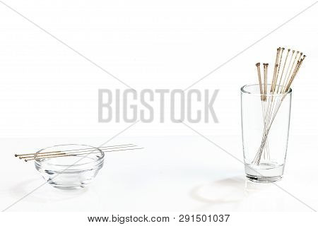 Silver Needles For Traditional Chinese Medicine Acupuncture. Close-up. White Background. There Is So