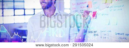 Stocks and shares against smiling businessman explainging strategies on whiteboard