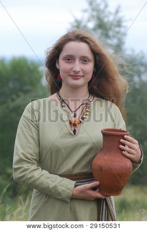 KIEV, UKRAINE - JULY 31: Member of history club Golden Capricorn wears medieval costume as she participates in historical festival in memory of King Vladimir July 31, 2009 in Kiev, Ukraine.