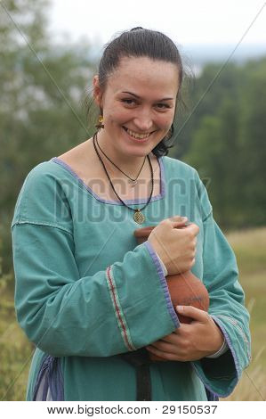 KIEV, UKRAINE - JULY 31: Member of history club Golden Capricorn wears medieval costume as she participates in historical festival in memory of King Vladimir July 31, 2009 in Kiev, Ukraine.