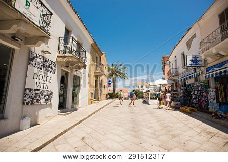 Santa Teresa Gallura, Sardinia, Italy - July 9, 2018: Street Shop and Cafe with Tourists in Santa Teresa Gallura City, Sardinia, Italy.