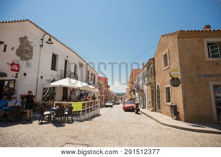 Santa Teresa Gallura, Sardinia, Italy - July 9, 2018: Street Shop and Cafe with Tourists in Santa Teresa Gallura City, Sardinia, Italy.