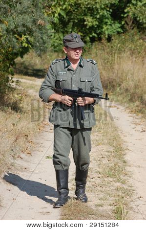 KIEV, UKRAINE - SEPT 19, : Member of a history club wear historical German uniforms as he participates in a WWII reenactment.Buttle for Kiev in 1943. September 19 , 2009 in Kiev, Ukraine
