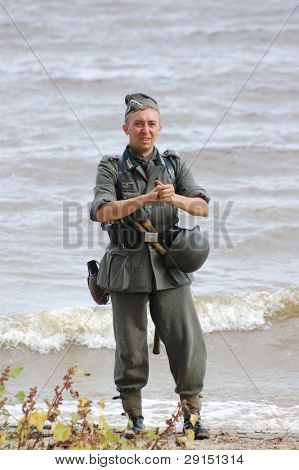 KIEV, UKRAINE - SEPT 19, : Member of a history club wear historical German uniforms as he participates in a WWII reenactment.Buttle for Kiev in 1943. September 19 , 2009 in Kiev, Ukraine