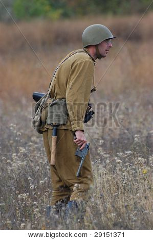 KIEV, UKRAINE - SEPT 19, : Member of a history club wear historical Soviet  uniforms as he participates in a WWII reenactment.Buttle for Kiev in 1943. September 19 , 2009 in Kiev, Ukraine
