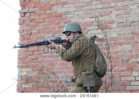 KIEV, UKRAINE - SEPT 19, : Member of a history club wear historical Soviet  uniforms as he participates in a WWII reenactment.Buttle for Kiev in 1943. September 19 , 2009 in Kiev, Ukraine