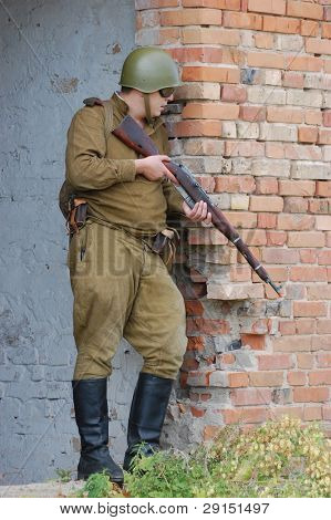 KIEV, UKRAINE - SEPT 19, : Member of a history club wear historical Soviet  uniforms as he participates in a WWII reenactment.Buttle for Kiev in 1943. September 19 , 2009 in Kiev, Ukraine