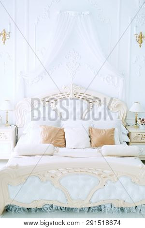 Luxury Bedroom Interior Design In White And Beige Colors With Tulle Baldachin Over The Bed, Plasterw