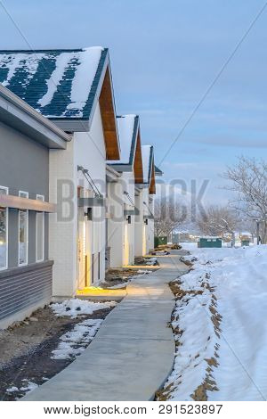 Pathway In Front Of Homes Viewed In Winter