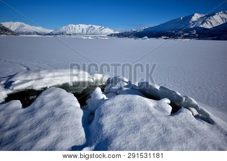 Ice Bumping In Alaskan Lake And Mountains