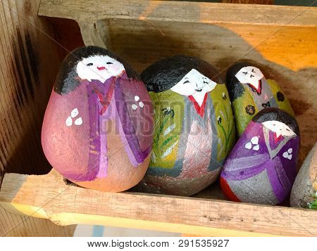 Close Up Picture Of Some Beautifully Painted Stone Figures Located Displayed In Front Of A Store In 