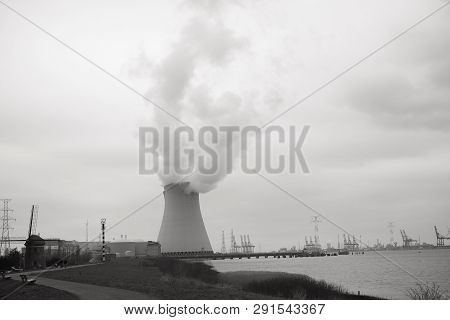 May 2016, Doel, Antwerp, Belgium, Cooling Towers Of The Nucleair Power Plant In Doel Next To The Riv