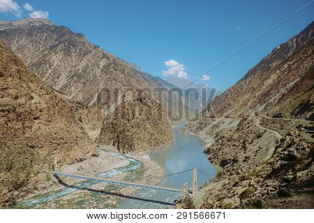 Indus River Flowing Through Mountains In Rural Area Of Pakistan. View From Karakoram Highway.