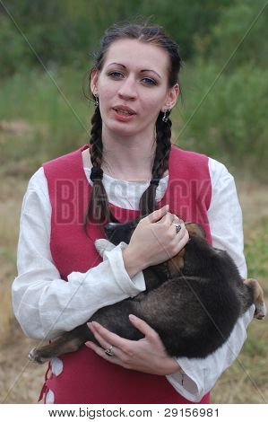 KIEV, UKRAINE - JULY 31: Member of history club Golden Capricorn wears medieval costume as she participates in historical festival in memory of King Vladimir July 31, 2009 in Kiev, Ukraine.