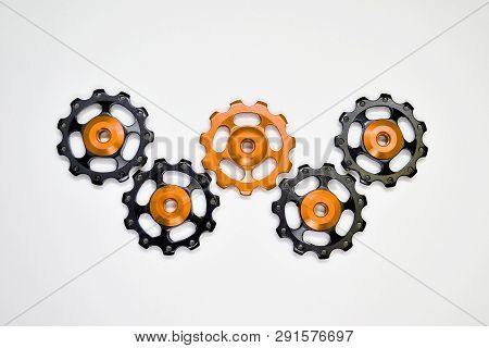 Color Rollers, Black, Golden Gears For Bicycle Rear Derailleur On White Background