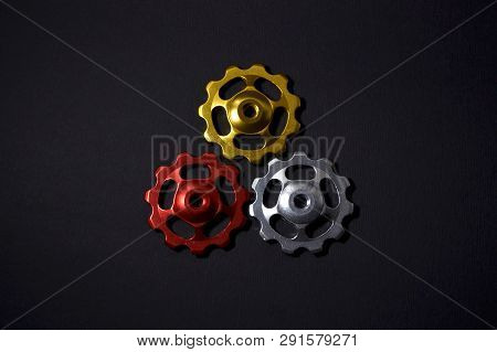 Color Rollers, Black, Golden, Silver Gears For Bicycle Rear Derailleur On Black Color In Shape Of Tr