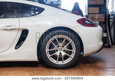 Novosibirsk, Russia - 08.01.18: Side Rear Wheel View Of Luxury Very Expensive New White Porsche Caym