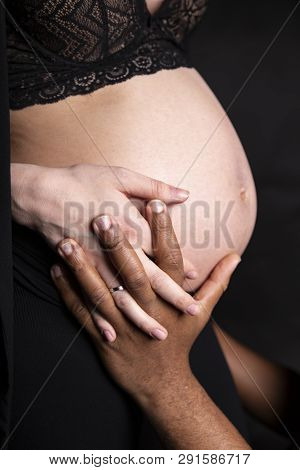 Parents Love. The Pregnant Woman And Father Of The Child Show Love.