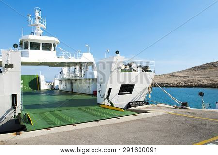 Car Ferry Boat In Croatia Linking The Island Rab To Mainland With Open Ramp, Waiting For Boarding.