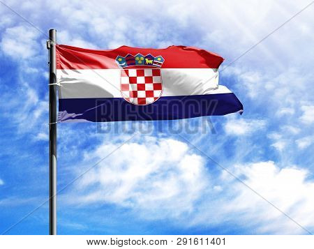 National Flag Of Croatia On A Flagpole In Front Of Blue Sky.