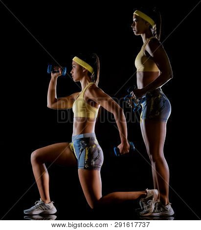 one mixed race woman exercising fitness exercises isolated on black background with lightpainting effect multiple exposures