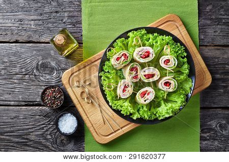 Overhead View Of Sliced Sandwich Wraps On Skewers. Roll-ups Of Whole Grain Flatbread With Yogurt Sau