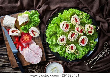 Sliced Sandwich Wraps On A Skewers On A Plate. Ingredients And Garlic Sour Cream Sauce In A Bowl On 