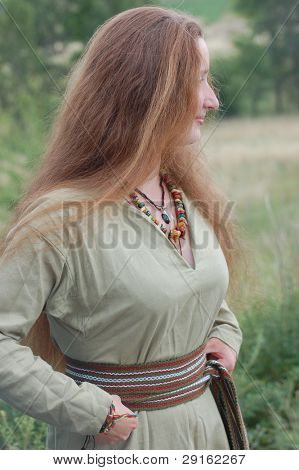 KIEV, UKRAINE - JULY 31: Member of history club Golden Capricorn wears medieval costume as she participates in historical festival in memory of King Vladimir July 31, 2009 in Kiev, Ukraine.