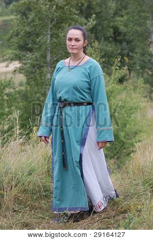 KIEV, UKRAINE - JULY 31: Member of history club Golden Capricorn wears medieval costume as she participates in historical festival in memory of King Vladimir July 31, 2009 in Kiev, Ukraine.