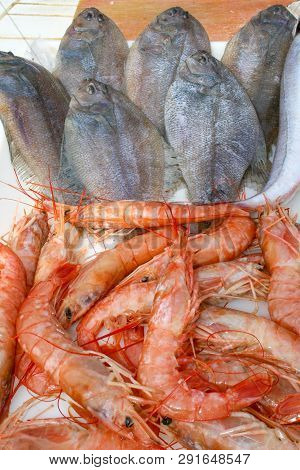 Fresh Red Shrimps Or Scarlet Shrimps And Soles In A Fish Market, Close Up