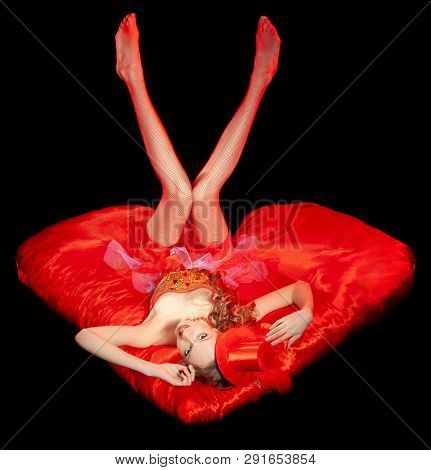 Sexy Burlesque Dancer Stripper Posing With Sweet Lollipop, In Red Corset And Red Hat With Curly Hair