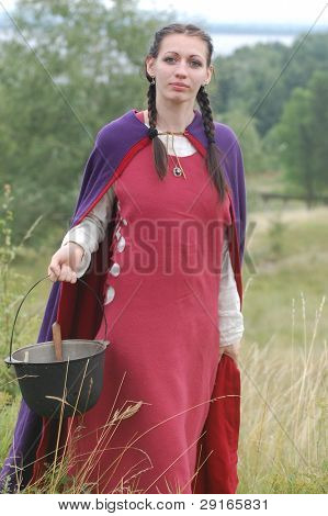 KIEV, UKRAINE - JULY 31: Member of history club Golden Capricorn wears medieval costume as she participates in historical festival in memory of King Vladimir July 31, 2009 in Kiev, Ukraine.