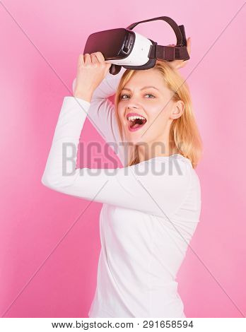 Woman Using Virtual Reality Headset. Pretty Woman Playing Game In Virtual Reality Glasses. Cheerful 