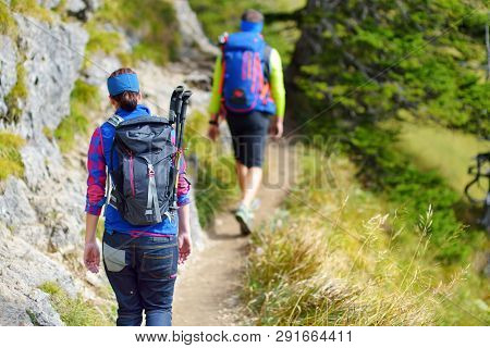 Tourists On A Hiking Trails Of Picturesque Tegelberg Mountain, A Part Of Ammergau Alps, Located Nead