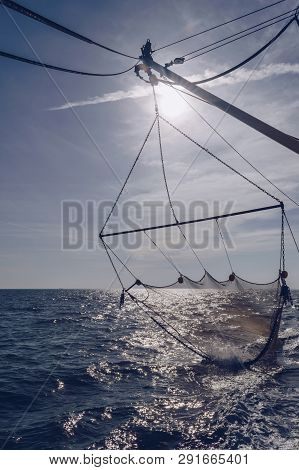 Straightened Trawler Net With Shining Sun And Blue Sky On Background
