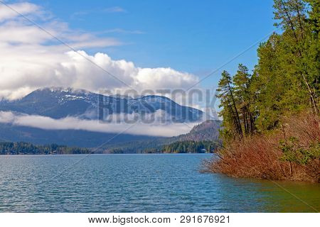 View from Sproat Lake provincial park with mountain and cloudscape in Vancouver Island, BC, Canada