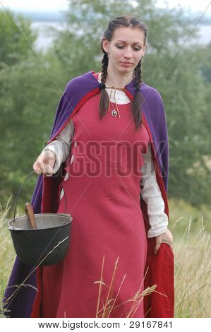 KIEV, UKRAINE - JULY 31: Member of history club Golden Capricorn wears medieval costume as she participates in historical festival in memory of King Vladimir July 31, 2009 in Kiev, Ukraine.