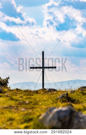 Cross On A Peak Of Austrian Mountain Schockl In Styria Graz. Place For Tourism And Hiking Recreation