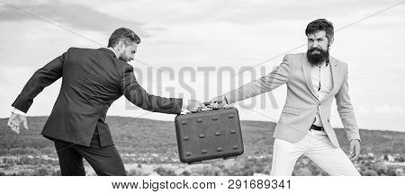 Businessman Takes Away Briefcase From Business Partner. Fraud And Extortion Concept. Man Cheating Wh