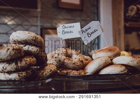 Close Up Of A Variety Of Bagels On Sale, Selective Focus.