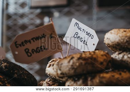Close Up Of A Variety Of Bagels On Sale, Selective Focus.