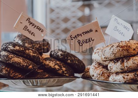 Close Up Of A Variety Of Bagels On Sale, Selective Focus.