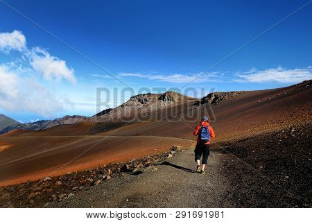 Tourist Hiking In Haleakala Volcano Crater On The Sliding Sands Trail. Beautiful View Of The Crater