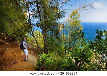 Young Male Tourist Hiking On Beautiful Pololu Loop Trail Located Near Kapaau, Hawaii, That Features 