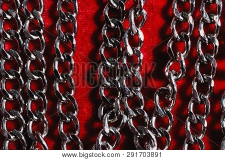 Jewelry On A Red Velvet Background. Silver Chain.vintage Background.