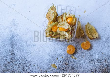 Physalis On A Light Background. Berry  On A Light Background. Golden Berries On A Light Background. 