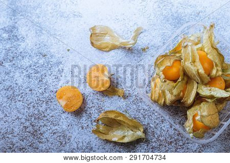 Physalis On A Light Background. Berry  On A Light Background. Golden Berries On A Light Background. 