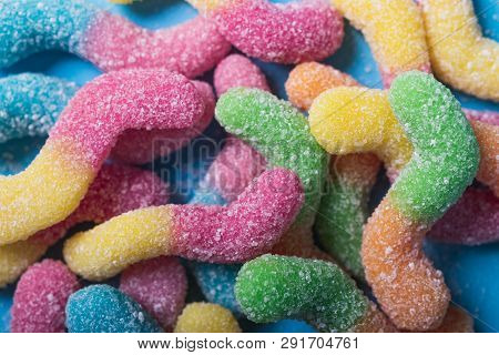 Background Of Colorful Candy. Multicolored Marmalade On A Blue Background. Background Pastel Colors.