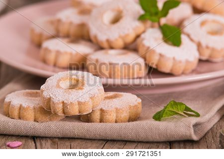Canestrelli Biscuits With Mint On Wooden Table.